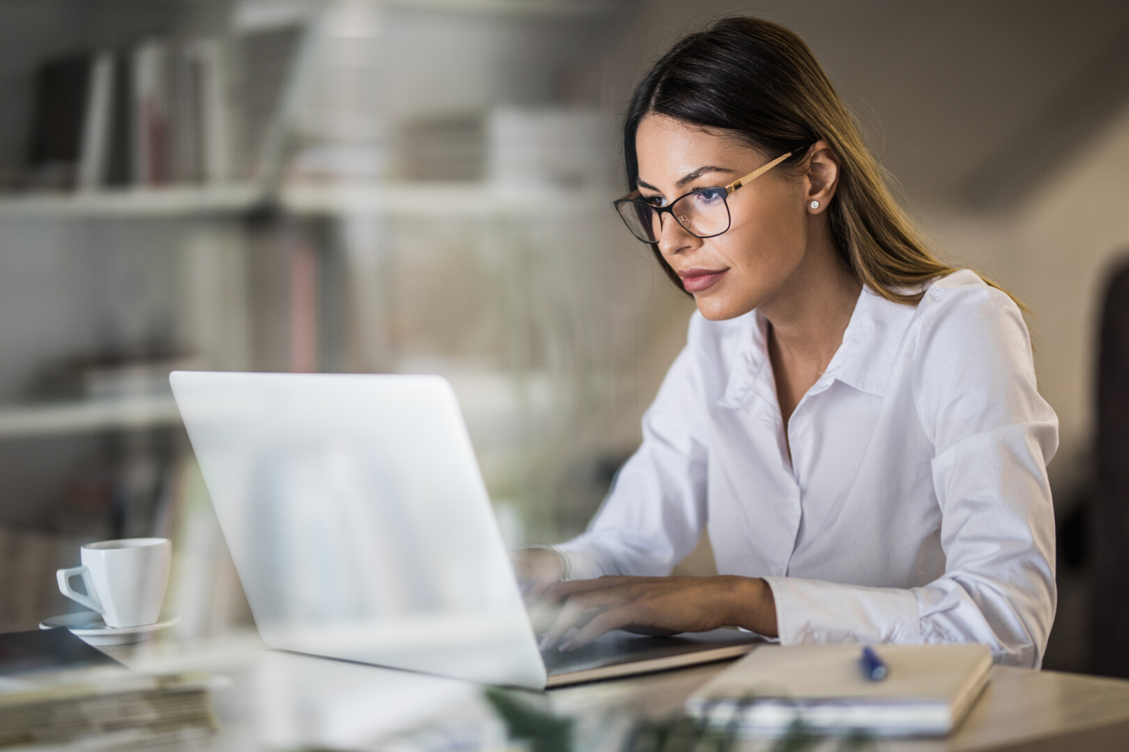 Young Businesswoman Typing An E Mail On Laptop At Home Office.